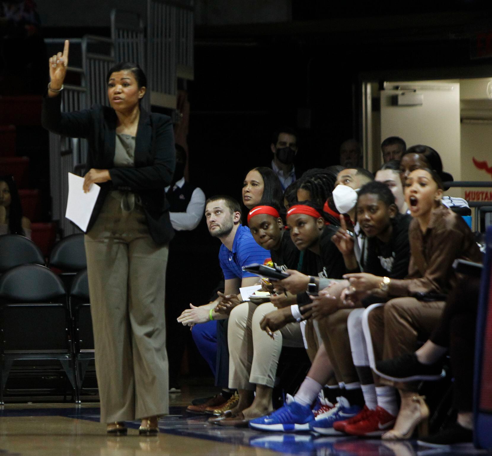 SMU head coach Toyelle Wilson directs her players from the team bench area during first half...