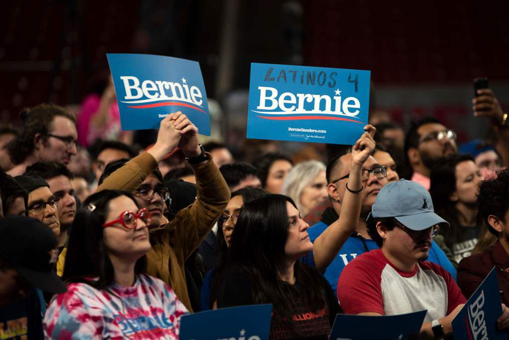 Supporters of Democratic presidential hopeful Bernie Sanders cheer during a rally at the University in Houston on February 23, 2020.