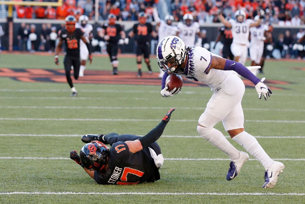 TCU safety Trevon Moehrig (7) comes down with the ball on an interception on a pass intended...