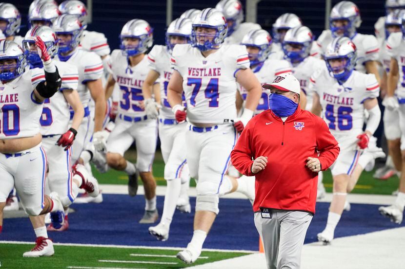 Austin Westlake head coach Todd Dodge takes the field with his team for the Class 6A...