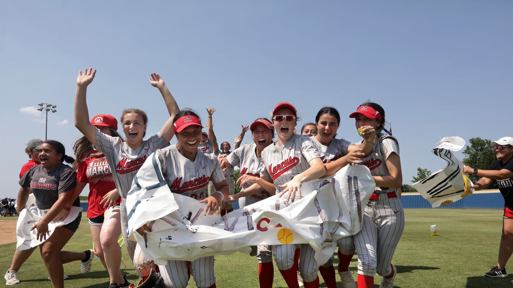 Flower Mound Marcus players celebrate after winning the decisive Game 3 in a best-of-3...