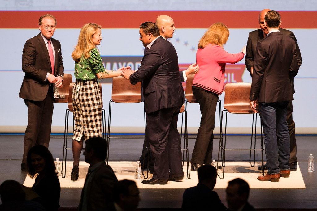 From left, Dallas mayoral candidates Mike Ablon, Lynn McBee, Jason Villalba, Miguel Solis,  Regina Montoya, Albert Black and Scott Griggs mingle at the conclusion of the Engage Dallas 2019 Mayoral Candidates Forum hosted by the Mayor's Star Council at the Music Hall at Fair Park on Friday, March 8, 2019, in Dallas. (Smiley N. Pool/The Dallas Morning News)