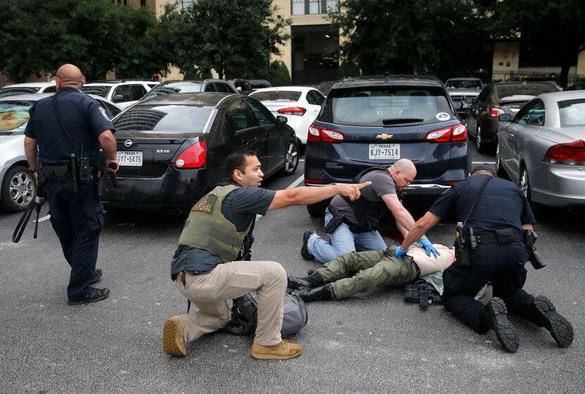 Members of the Department of Homeland Security and the U.S. Marshals Service tend to the...