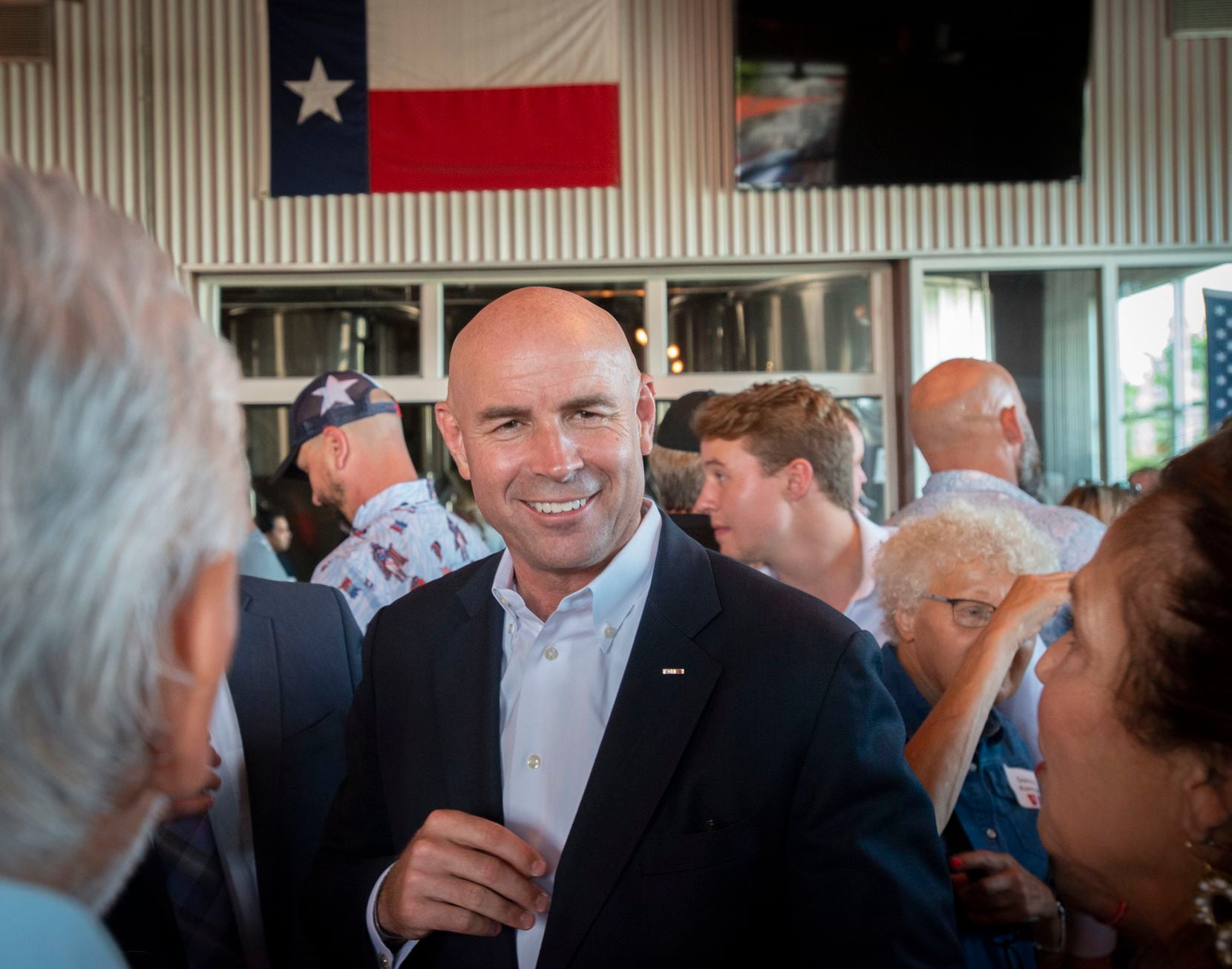 Congressional District 6 candidate Jake Ellzey talks with supporters during an evening fundraiser at Legal Draft in Arlington, Texas on July 14,, 2021. (Robert W. Hart/Special Contributor)