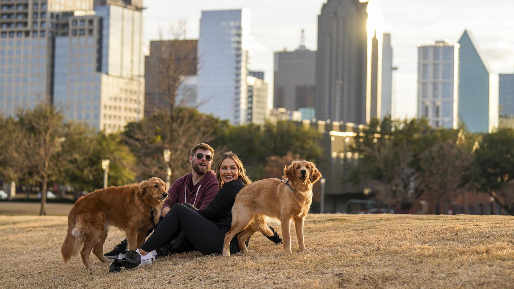 Kyle Brown and Jessica Bradford relax at Griggs Park with their dogs Addie and Sandy on...