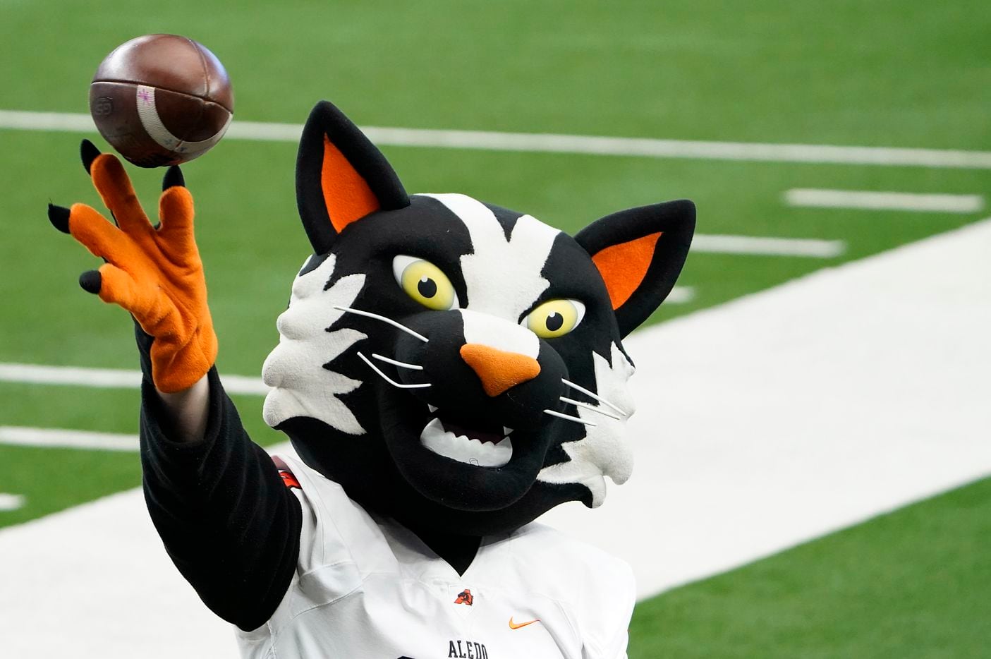 The Aledo mascot tosses a ball on the sidelines during the first half of the Class 5A Division II state football championship game against Crosby at AT&T Stadium on Friday, Jan. 15, 2021, in Arlington. (Smiley N. Pool/The Dallas Morning News)