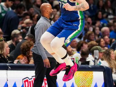Dallas Mavericks guard Luka Doncic reacts after missing a 3-point attempt during the first...