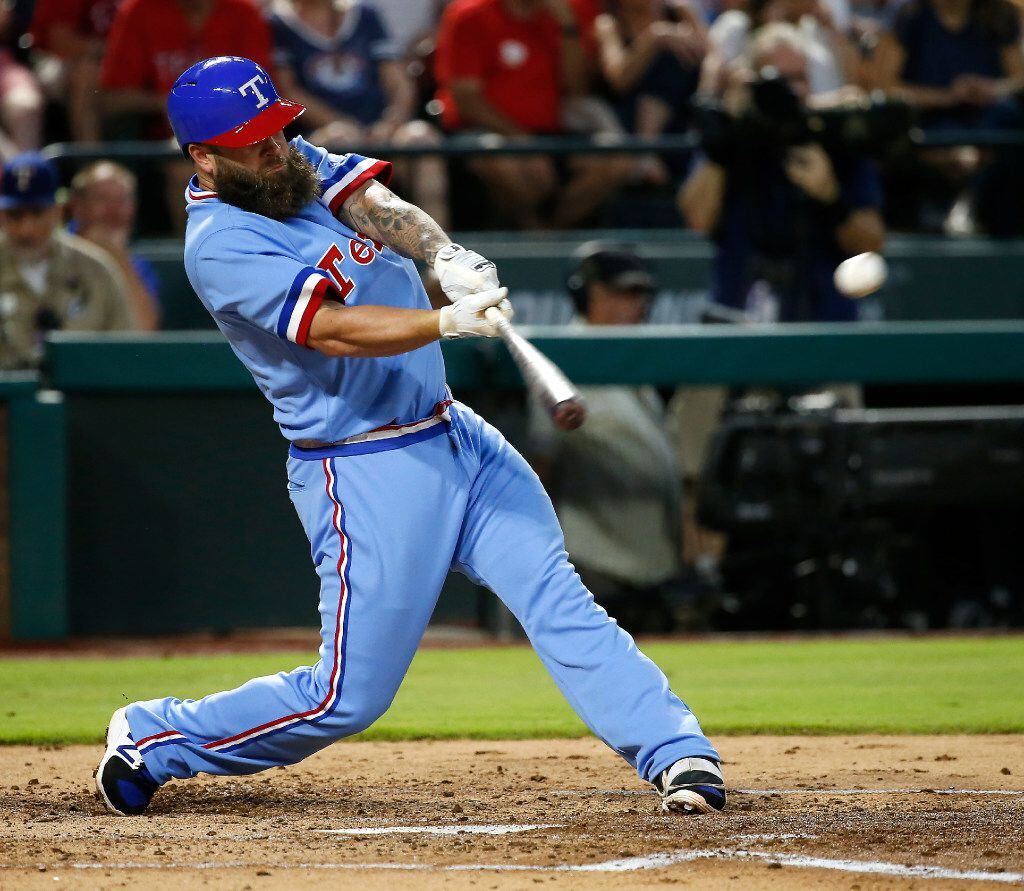 Texas Rangers first baseman Mike Napoli (5) hits a double against Los Angeles Angels during...