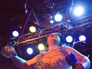 Passionata Fair blows bubbles during her burlesque performance Saturday night.