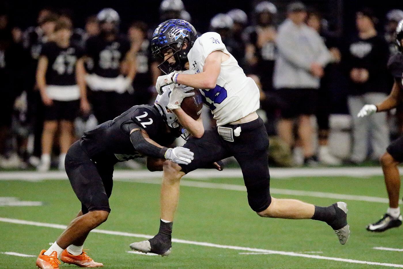 Byron Nelson High School wide receiver Kurt Ippolito (18) is tackled by Guyer High School...