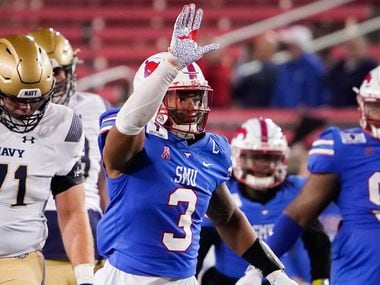 SMU linebacker Delano Robinson (3) celebrates after sacking Navy quarterback Dalen Morris (8) during the third quarter of an NCAA football game at Ford Stadium on Saturday, Oct. 31, 2020, in Dallas.
