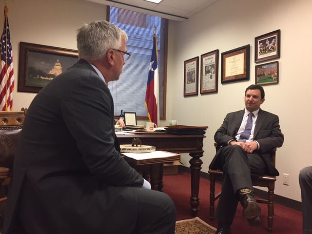 Badger (left) talks roofing with State Rep. Craig Goldman, R-Fort Worth in Goldman's office.