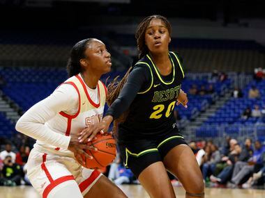 DeSoto guard Ayanna Thompson (20) tries for the steal on South Grand Prairie guard Jahcelyn...
