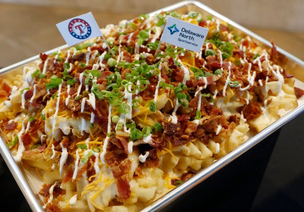 The Bacon and Cheddar Loaded Fries are waffle cut fries topped with sour cream, smoked...