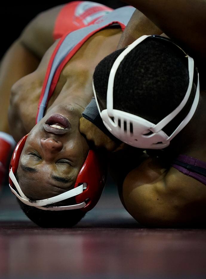 Moustapha Bal of Ohio State (left) wrestles Ty'Rae Carter of Texas A&M in a 149 lbs...