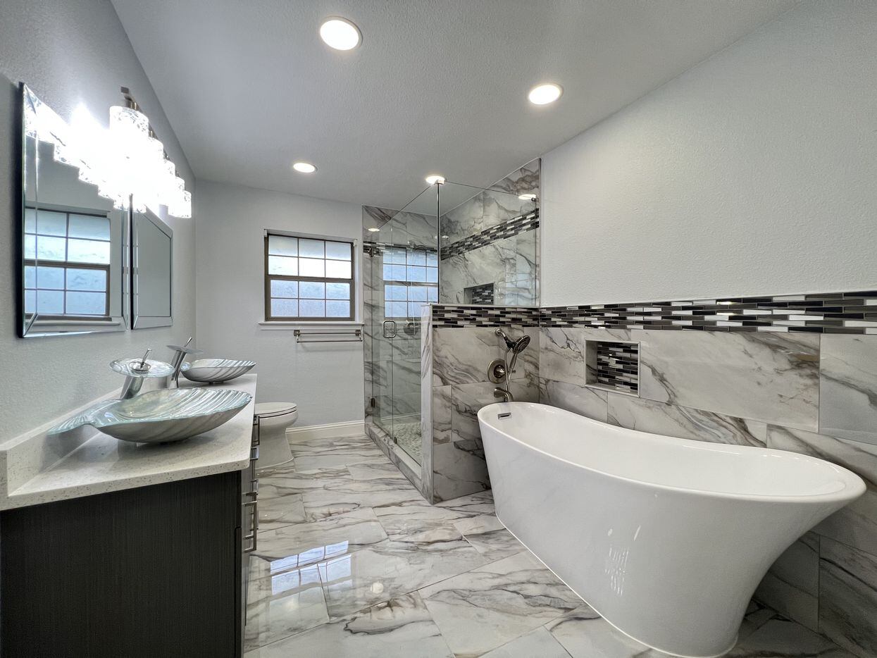 Bathroom with updated shower, bathtub and sinks