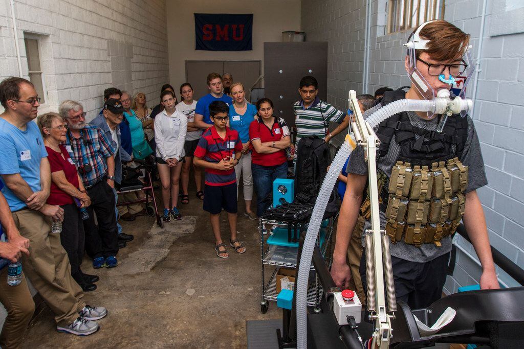 Joel Booth, an undergraduate research assistant, demonstrates a breathing task during...