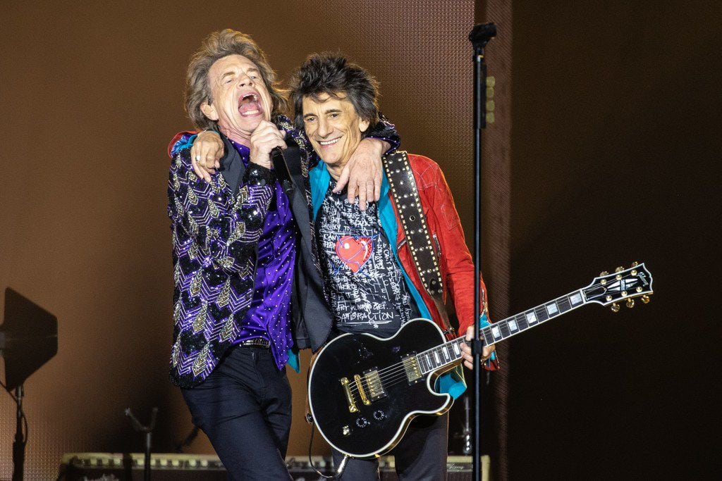Mick Jagger (left) and Ronnie Wood (right) perform on stage at NRG Stadium on July 27, 2019...