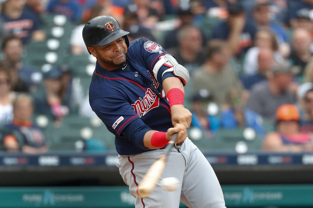 Minnesota Twins designated hitter Nelson Cruz hits a single in the fifth inning of a...