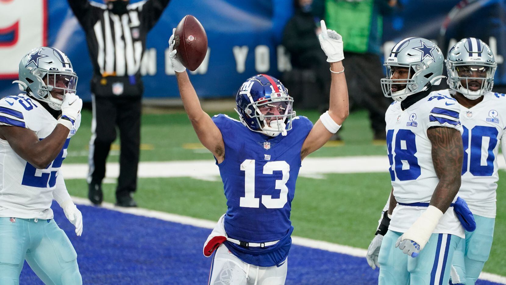 New York Giants' Dante Pettis, center, celebrates his touchdown during the first half of an...