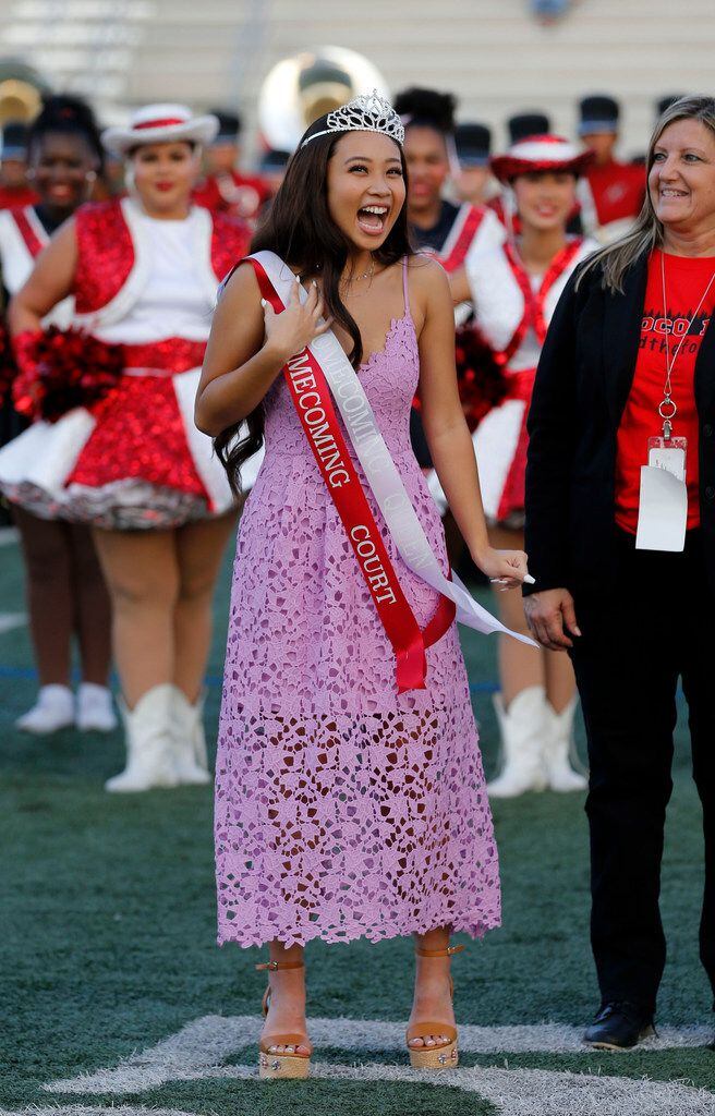 North Garland's Tram Phan, a senior, reacts, after being named homecoming queen before the...