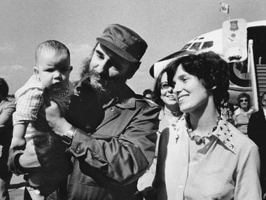 In this Jan. 26, 1976 photo, Margaret Trudeau smiles as Cuban President Fidel Castro holds...