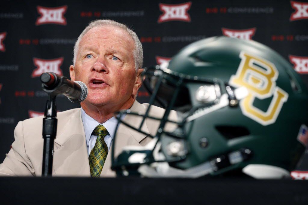 New Baylor head football coach Jim Grobe responds to reporters questions during the Big 12...