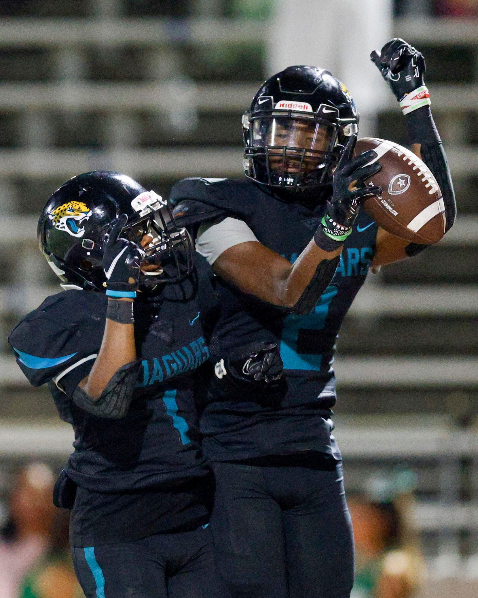 Molina wide receiver Mikaviion Jones (2) celebrates his touchdown with running back Terrence...