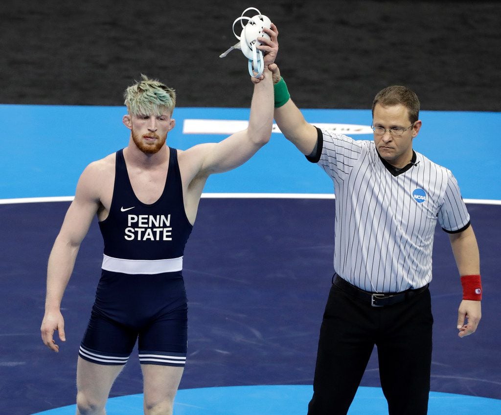 Penn State's Bo Nickal, left, wins his