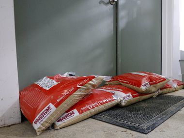 Sandbags block the front doors after heavy rain brought water flooding into Flea Style in...