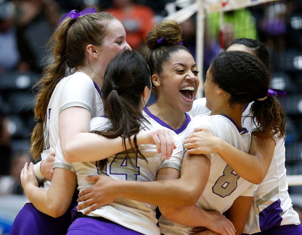 The Lamar Fulshear Chargers celebrate after scoring in the second set of a Class 4A...