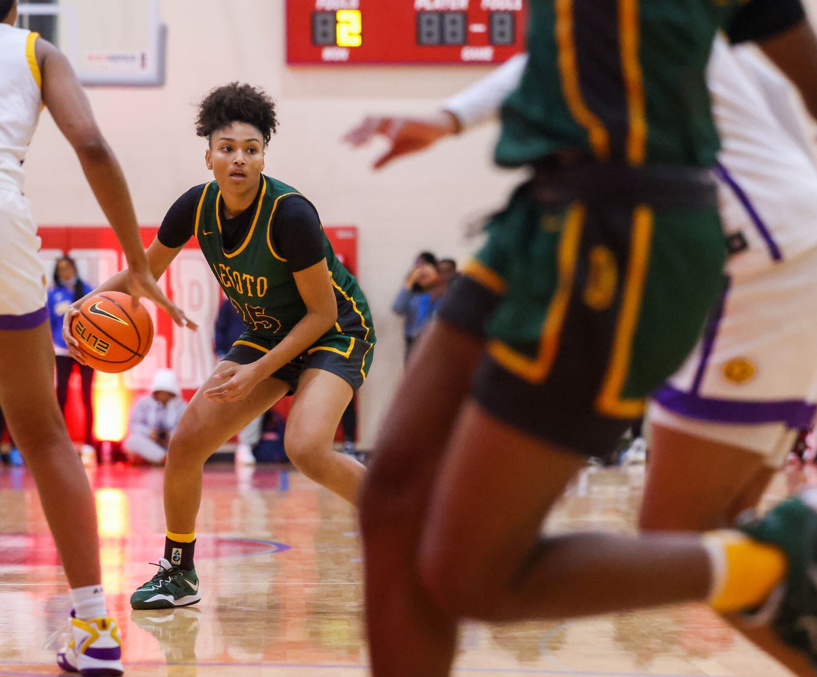 DeSoto shooting guard Amayah Garcia (25) looks to make a pass during a game against...