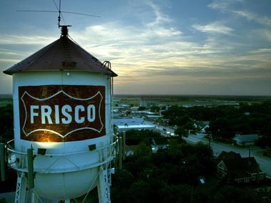 July 30, 2003 --The Frisco water tower looms over downtown at dusk as one of the city's most unique and recognizable landmarks. The Heritage Association of Frisco will be dedicating the tower with a historical marker this coming fall.