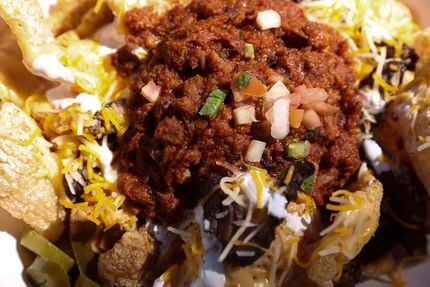 Dallas Morning News staff members gave Chicharron Explosion Nachos a 1.79 out of 5 at a...