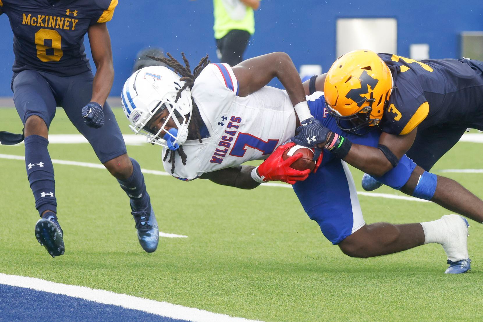 Temple High’s Mikal Harrison-Pilot (7), left, gets tackled by  McKinney High’s Myles Elam...