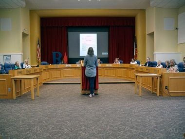 Richardson ISD school board members listen to a speaker during a meeting at the administration building on Monday.