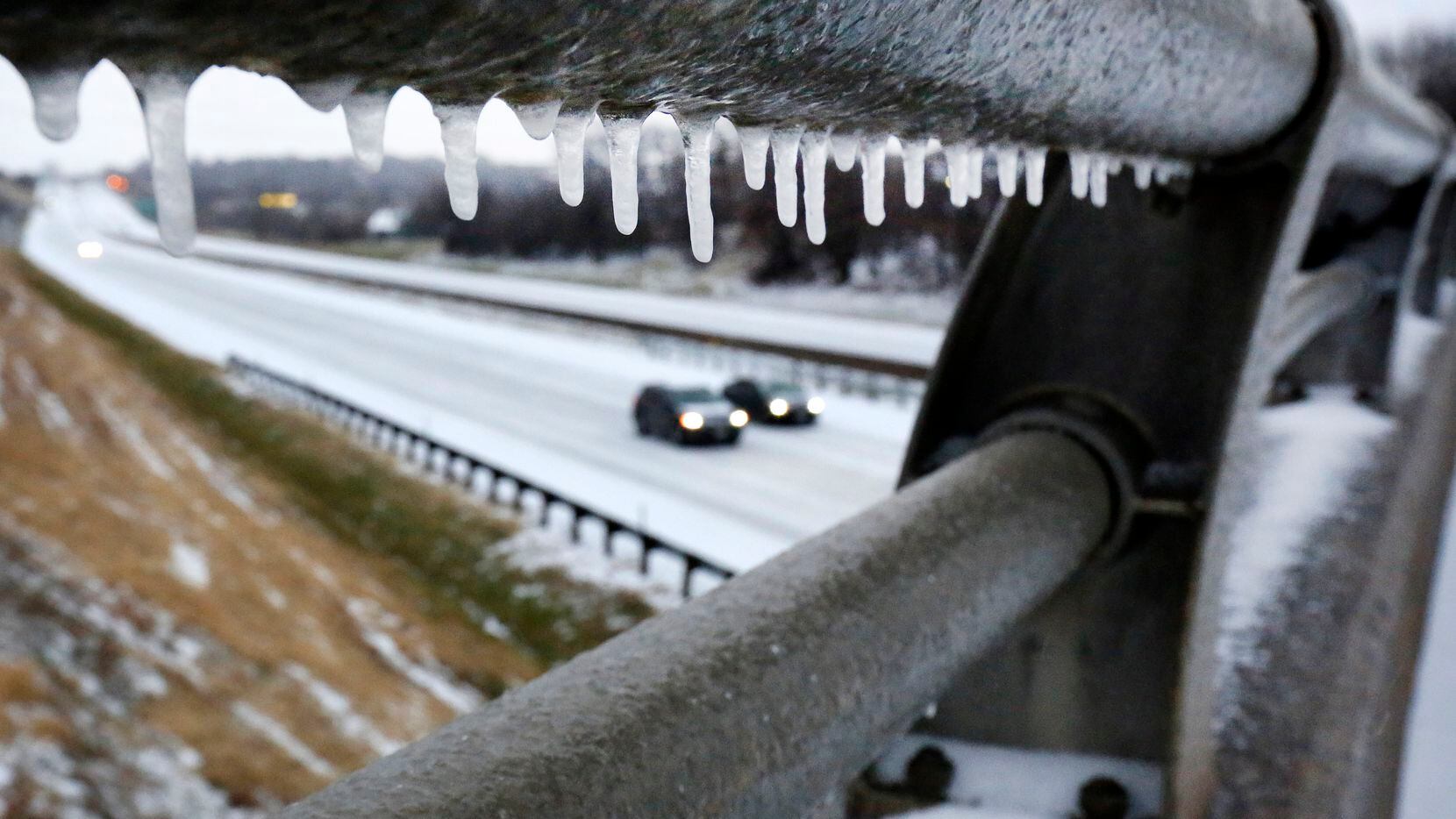 Freezing rain overnight created icicles on a bridge crossing Interstate 30 in East Fort...
