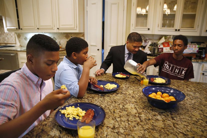 From left, William Waters, Christopher Waters, James Waters and Joshua Waters eat breakfast...