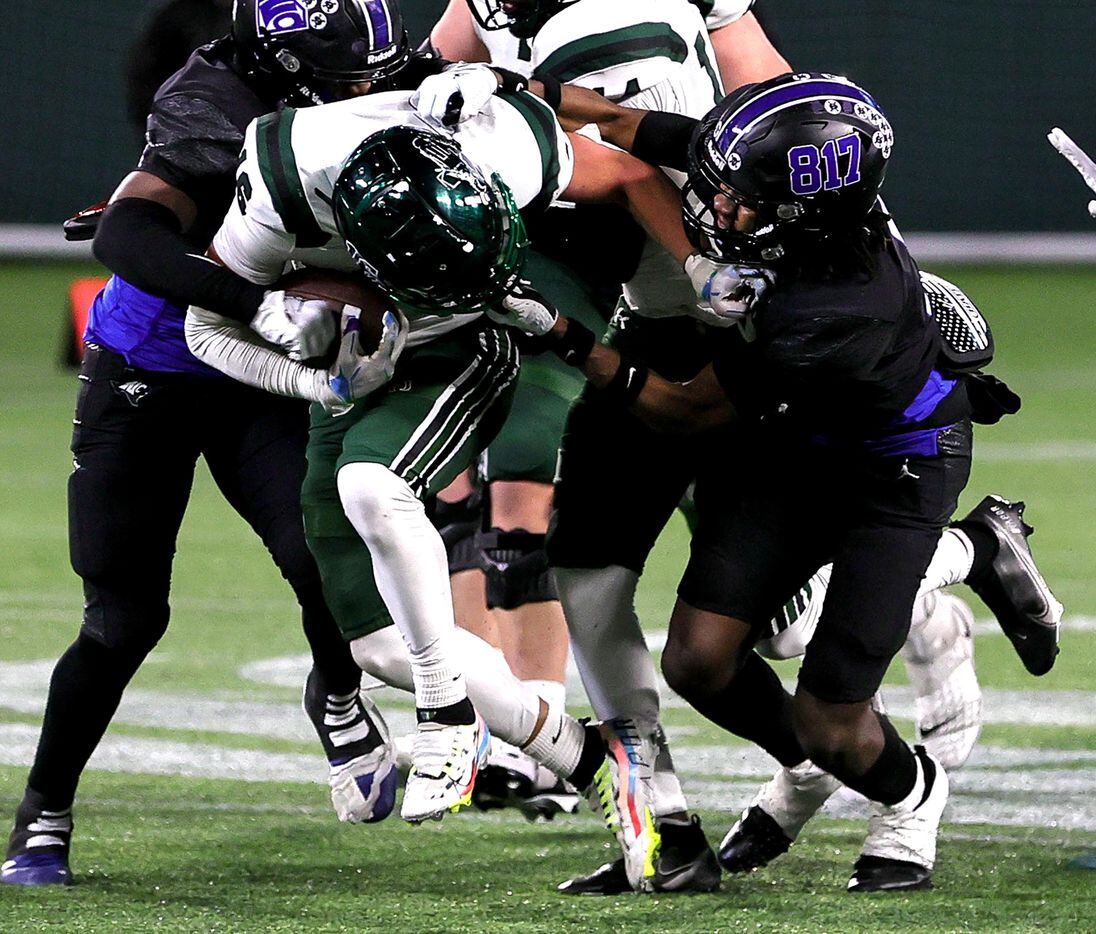 Prosper wide receiver Trevor Montayne (16) gets his face mask pulled by North Crowley...