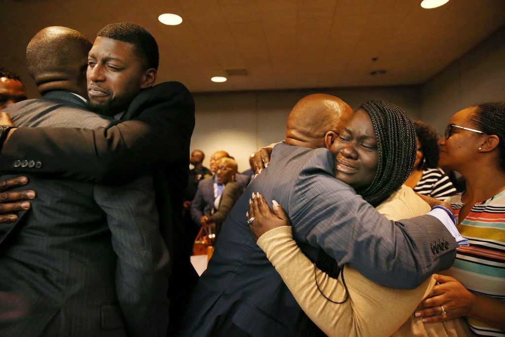 Odell Edwards and Charmaine Edwards, parents of Jordan Edwards, embrace supporters after a guilty verdict in the trial of former Balch Springs police officer Roy Oliver.