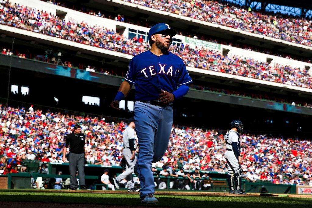 Texas Rangers catcher Jose Trevino (56) walks back to the dugouts during a MLB game between...