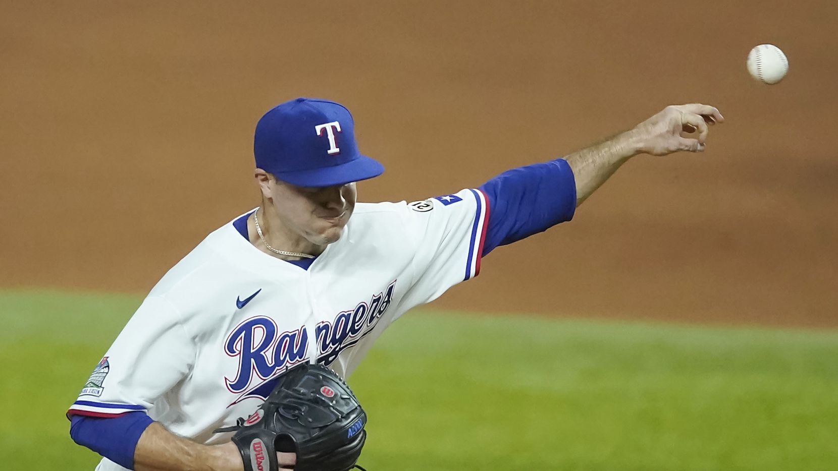 Texas Rangers relief pitcher John King delivers during the fourth inning against the Los...