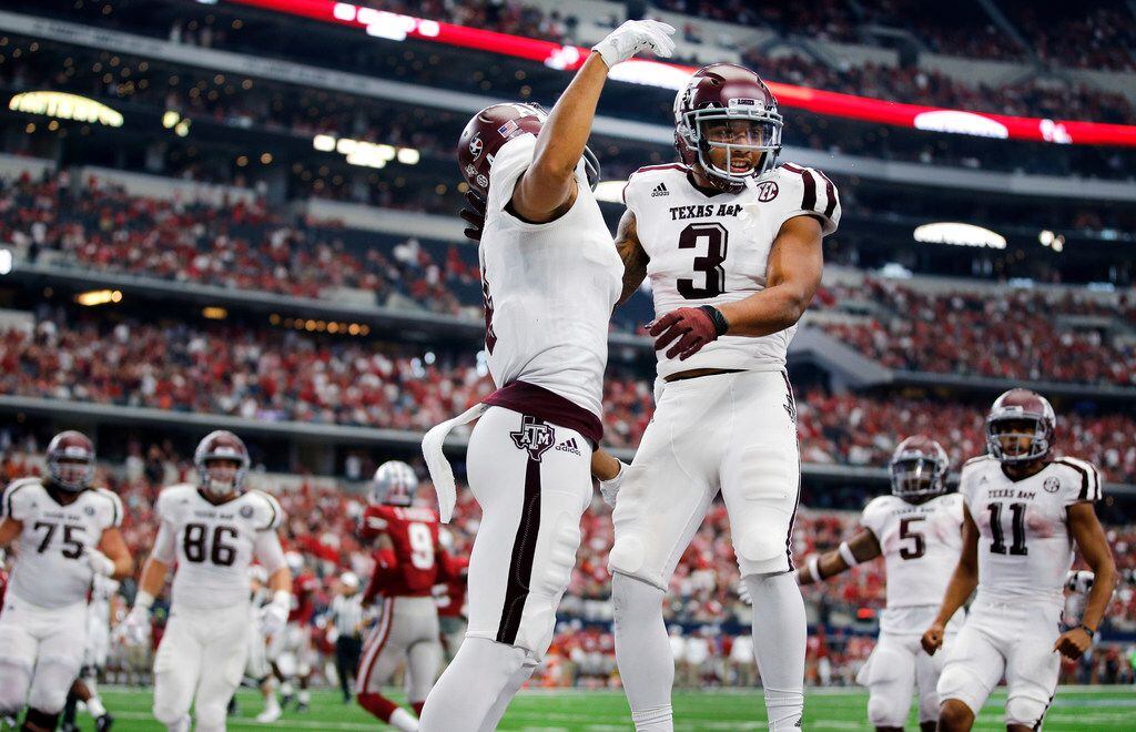 Texas A&M Aggies wide receiver Christian Kirk (3) is congratulated on his fourth quarter...