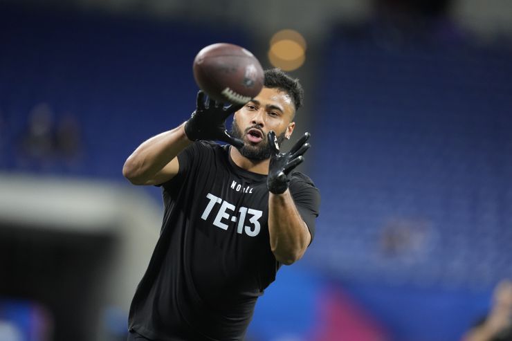 Minnesota tight end Brevyn Spann-Ford runs a drill at the NFL football scouting combine,...