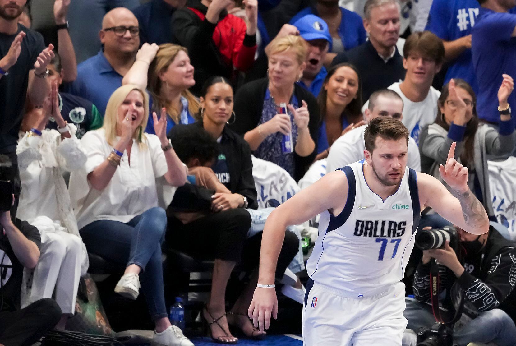 Dallas Mavericks guard Luka Doncic (77) celebrates after scoring during the first quarter in...