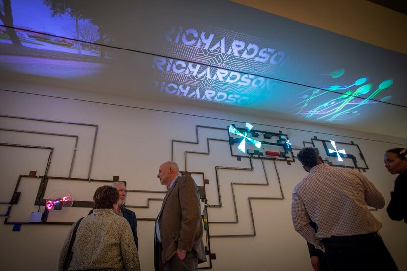 Guests gather in front of the art installation “Motherboard” in the Green Mezzanine Gallery...