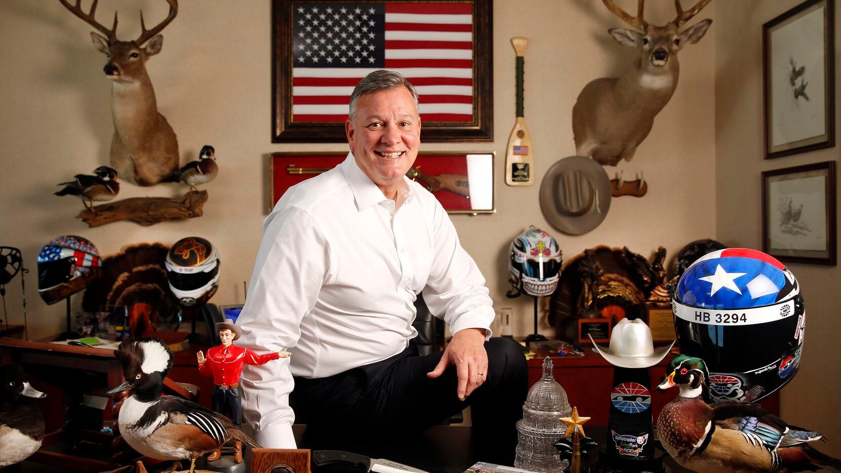 Texas Motor Speedway general manager Rob Ramage poses for a photo in his office filled with...