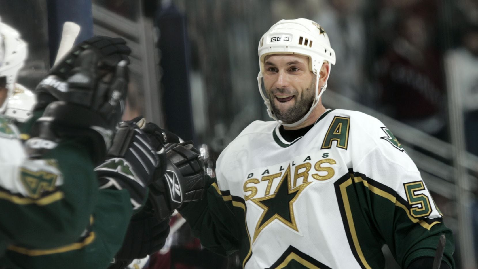 FILE - Dallas Stars defenseman Sergei Zubov of Russia celebrates with teammates after scoring a goal in the shootout in the Stars' 3-2 victory over the Colorado Avalanche in an NHL hockey game in Denver, Thursday, jan. 26, 2006. (AP Photo/David Zalubowski)