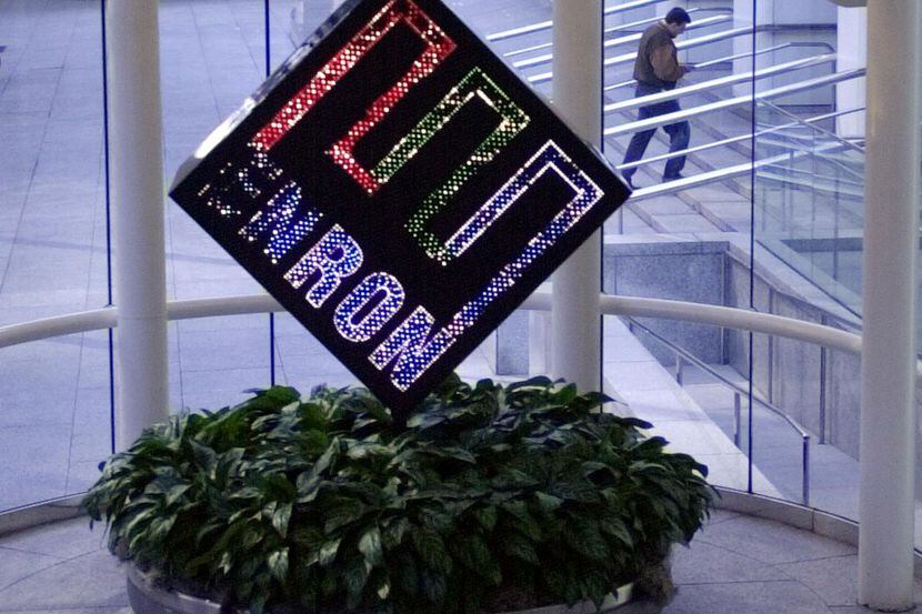 This Feb. 11, 2002 file photo shows a revolving Enron Corp. logo spinning in the lobby of...