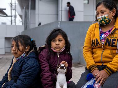 Isabela Julaj, right, sits with her daughters Yésica, (center) 7, and Maria Francela, 8,...